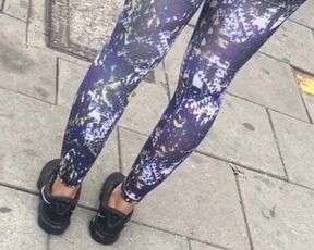 Light skin Caribbean woman in colourful leggings