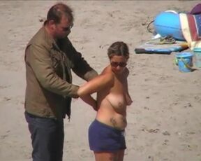 German milf on french beach spy. Shaky quality.