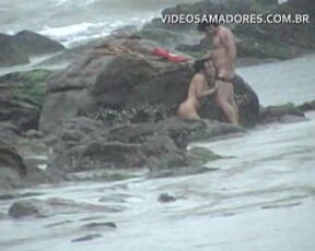 Couple is caught fucking on the beach during storm